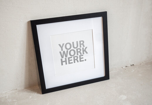 Square poster black frame with passepartout mockup standing on floor