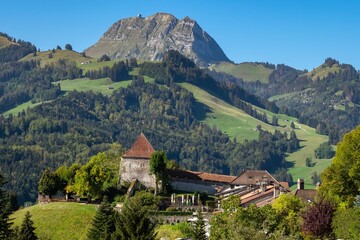 A mountain range with a small village in the valley below