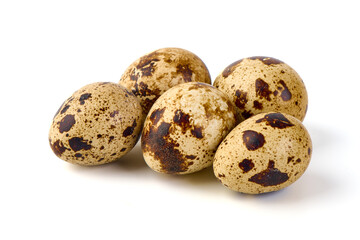 Quail eggs, close-up, isolated on white background.