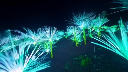 Vibrant neon fiber optic light display in nighttime garden - Powered by Adobe