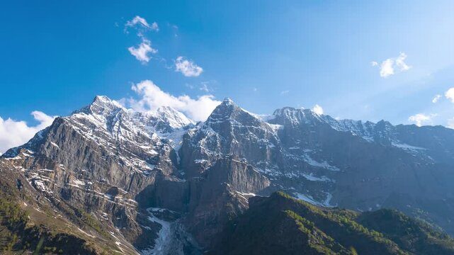4K Time Lapse shot of clouds above the snowy Himalayan mountain peaks as seen during the day at Khangsar Village in Lahaul and Spiti district, Himachal Pradesh, India. Clouds above the mountains.