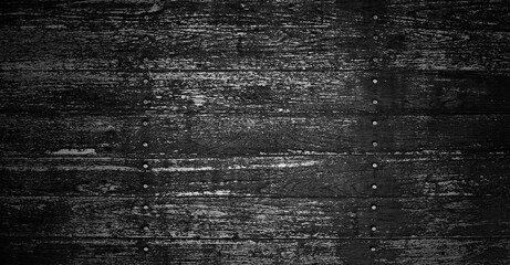 Scratched brown black wooden textured flooring background