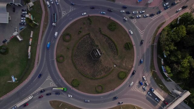 This is an aerial view of a bustling roundabout in Ternopil, Ukraine, showing the flow of traffic and cityscape below