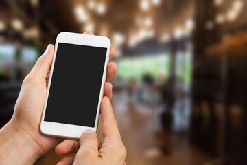 Hand hold a mobile phone on the street