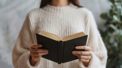 Fototapeta premium Woman reading constitution book for International Democracy Day, knowledge and rights concept.