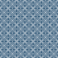 Seamless floral pattern with simple four-petal leaf shapes on denim blue background. Suitable for various design purposes of textiles, tiles, wallpapers, backgrounds, etc.