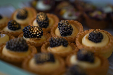 Candy bar at a wedding. Delicious desserts. Beautiful decorations. Fruits. Sweet cakes on your holiday. Birthday. Sweet life. interior photo.