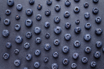 Blueberry berries on a dark background, pattern