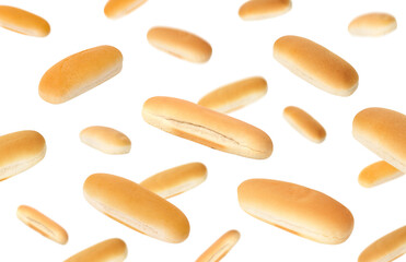 Fresh hot dog buns in air on white background