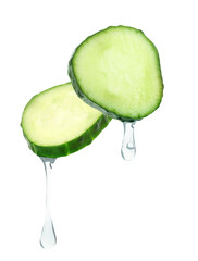 Cucumber slices with water drops in air on white background