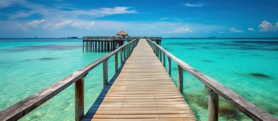 Wooden Pier Extending into a Turquoise Sea