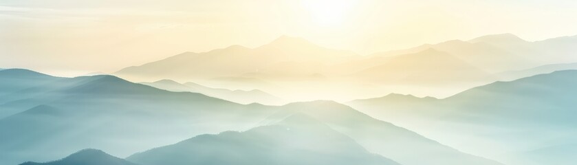 Fototapeta premium Serene sunrise over misty mountain range with soft colors and a peaceful atmosphere, capturing the beauty of nature.