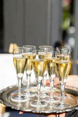 silver tray of sparkling champagne in glasses at new years eve celebration