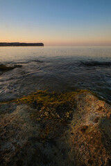 seascape rocky beach at sunset