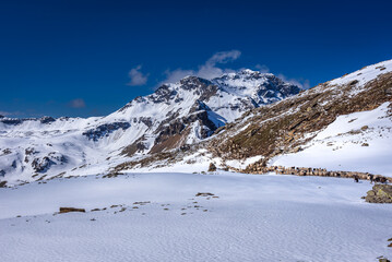Obraz premium Rupin Pass is a high altitude trek in Himachal Pradesh located at 4650m.Trek is full of diversity from majestic Himalayan ranges to waterfalls, glacial meadows, snow-covered landscapes, lush forests.