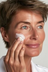 woman applying face cream