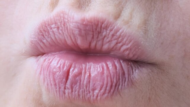 happy woman smiling, puts lips together for air kiss, close up lips of mature female face, Women's Health and Self-Esteem concept, Exploring Age-Related Changes