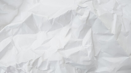 Crumpled blank white paper texture representing recycling, creative process, and environmental sustainability concepts