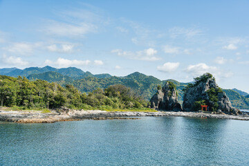 Isolated shinto shrine on Bentenjima island in Nachikatsuura, Japan. Scenic rocky landscape from the Pacific coast