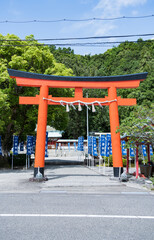 A shinto temple and Torii gate shrine in Katsuura, Nachikatsuura, Higashimuro District, Wakayama , Japan. English transl. from the blue flags: Eightfold Way.