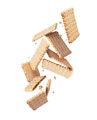 Levitation of whole and crushed crispy cookies in the air in white space
