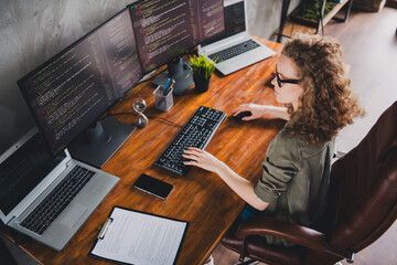 Photo of attractive confident successful woman software developer sitting armchair reading site...