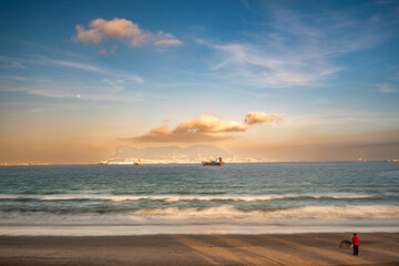 Spectacular Beach Sunset View With Boats And Gibraltar in the Distance