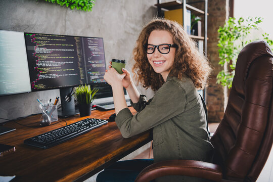 Photo of lovely confident successful woman software developer sitting armchair comfortable workspace workstation indoors