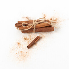 Bundle of Cinnamon with Some Ground on White Background