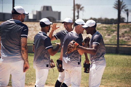 Baseball player, men and team in celebration, winning and handshake for goals, performance or success. People, group and diversity with support, motivation or happy on field for competition in Boston