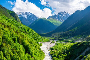 Naklejka premium Beautiful view of the valley of the mountain river among the high mountains. The North Caucasus. Russia