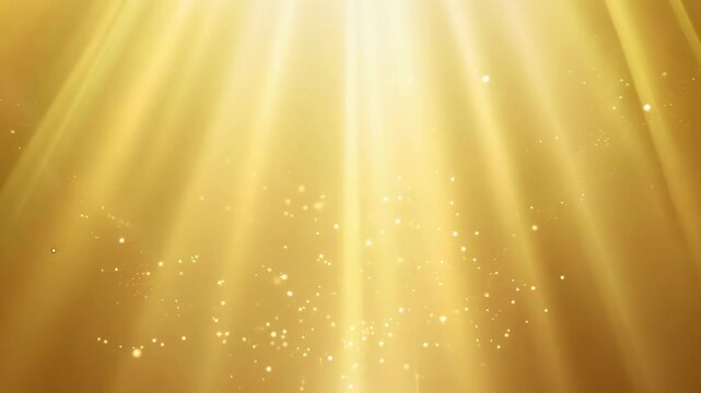 Particles and rays of light on a golden background