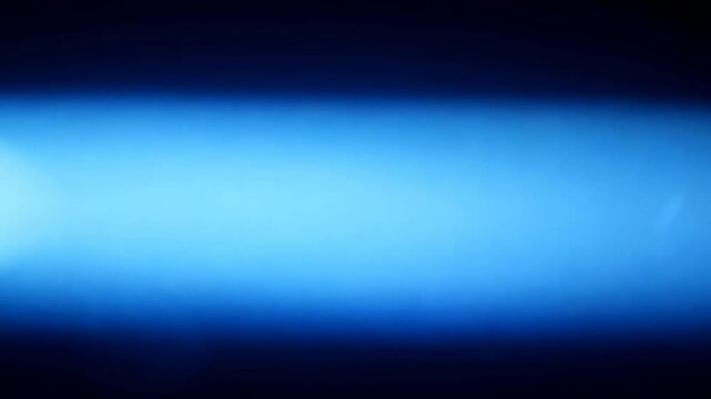 Blue rays of light on a black background