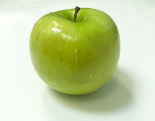 mouthwatering fresh green apple fruit with stem on white background
