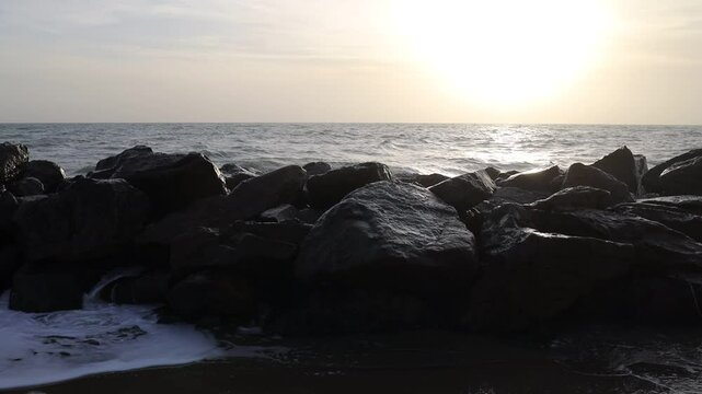 Waves on a rocky beach. Ocean coastline. Stop motion moving image clip mp4. Santa Severa, Italy - Italia