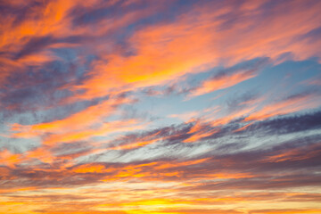 Utterly spectacular sunset with colorful clouds lit by the sun.