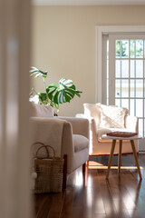 Beautiful home interior with hardwood floors glowing in bright afternoon sunlight