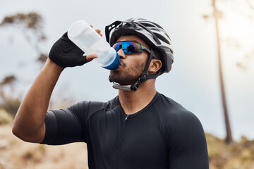 Man, break and drinking water with bottle while cycling for fitness, health and french sports...