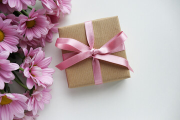gift concept. mockup of a card with a gift box and a bouquet of flowers