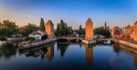 Naklejka premium Ponts Couverts Covered Bridges, Petite France canals, Strasbourg, France, sunset