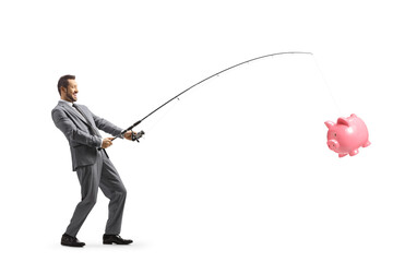 Obraz premium Businessman catching a piggy bank with a fishing rod