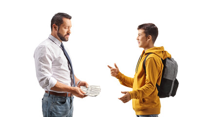 Businessman counting money and talking to a male teenage student