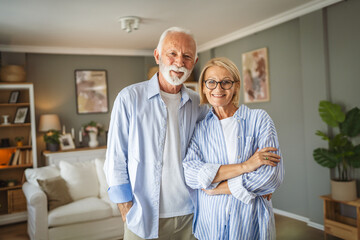 Obraz premium Portrait of senior husband and wife stand hug and smile