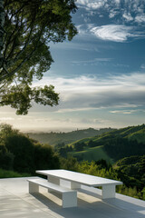Dinning area with modern furniture and views of the green hills.