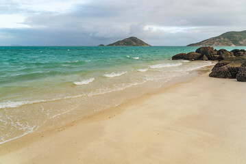 Picturesque tropical golden sandy Mangrove Beach with turquoise water on Blue Lagoon bay, Lizard Island, Australia. Lizard Island  is situated on Great Barrier Reef in north-east part of Queensland