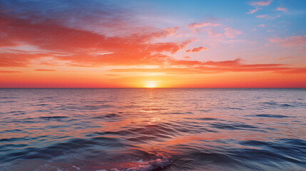 Fototapeta premium Sunset Over Tranquil Ocean Waves with Colorful Sky and Gentle Reflections
