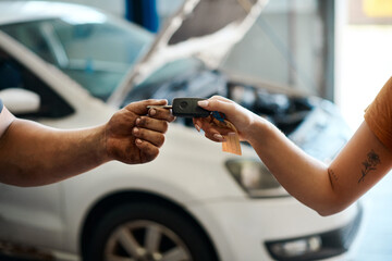 Repair, service and mechanic hands with keys for maintenance and transport at workshop or garage....