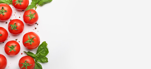 Fresh ripe tomatoes, spices and basil leaves on white background