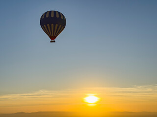 Experience the magic of Egypt as you gently glide a hot air balloon over the iconic pyramids, bathed in the soft glow of the rising sun at dawn. Vision of the grandeur of ancient civilizations.