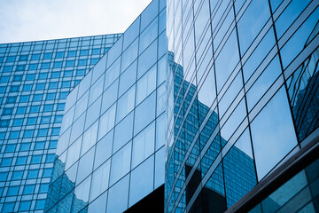 Business building with glass windows and offices background. Finance, luxury, economy, development, money concept. © yassine